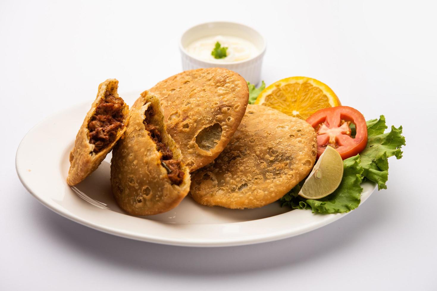 Keema kachori is a popular indian or pakistani flacky, crispy and delicious snack with yummy qeema filling also known as Khasta Kheema Kachauri photo