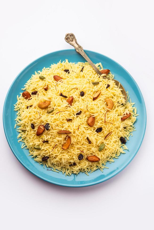 Kashmiri sweet modur pulao made of rice cooked with sugar, water flavored with Saffron and dry fruits photo