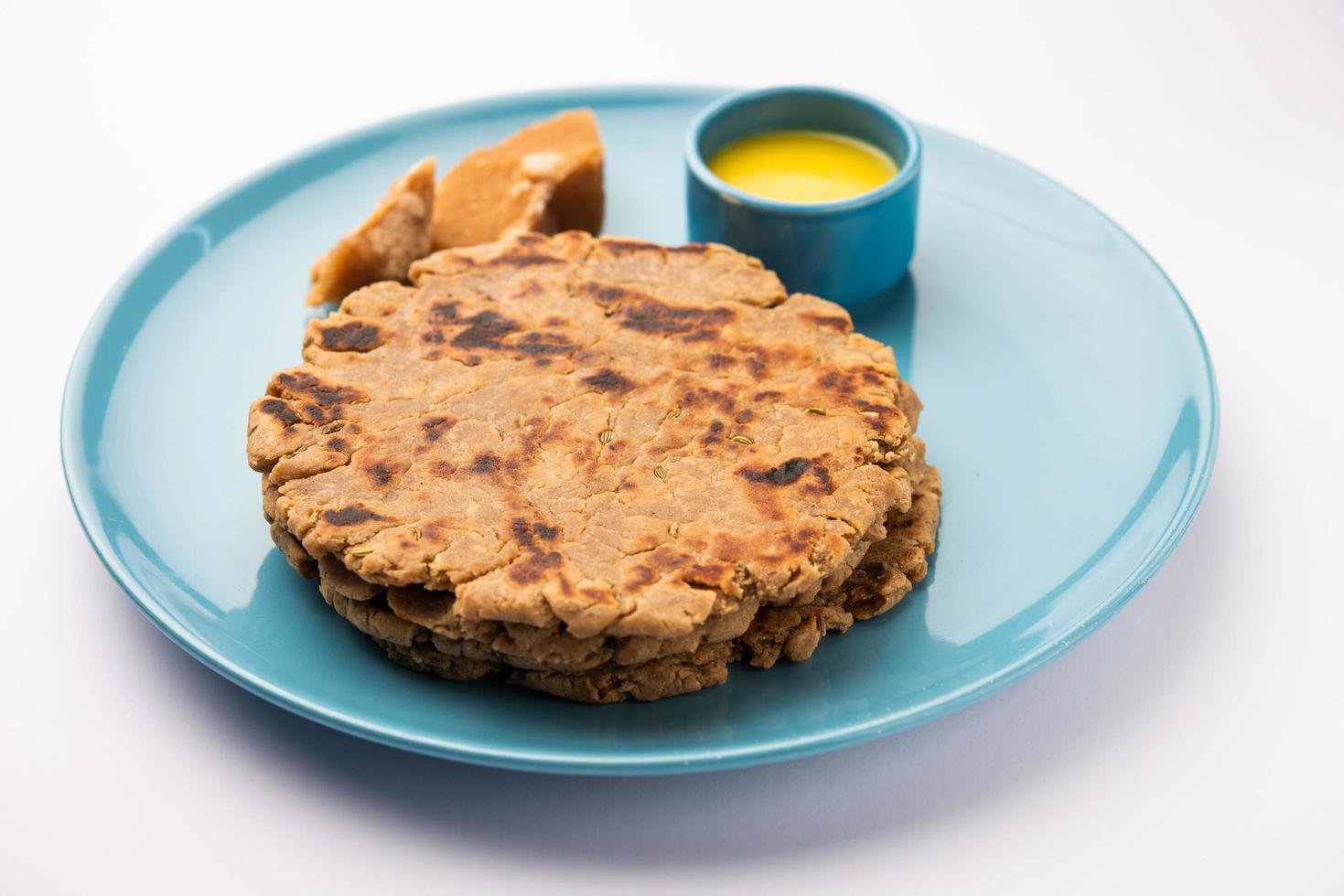 Sweet roti made out of rice flour, jaggery, and ghee. Gud ki roti. gur ki roti, jaggery Bhakri, meethi gud ki roti. Winter food. Copy space. photo