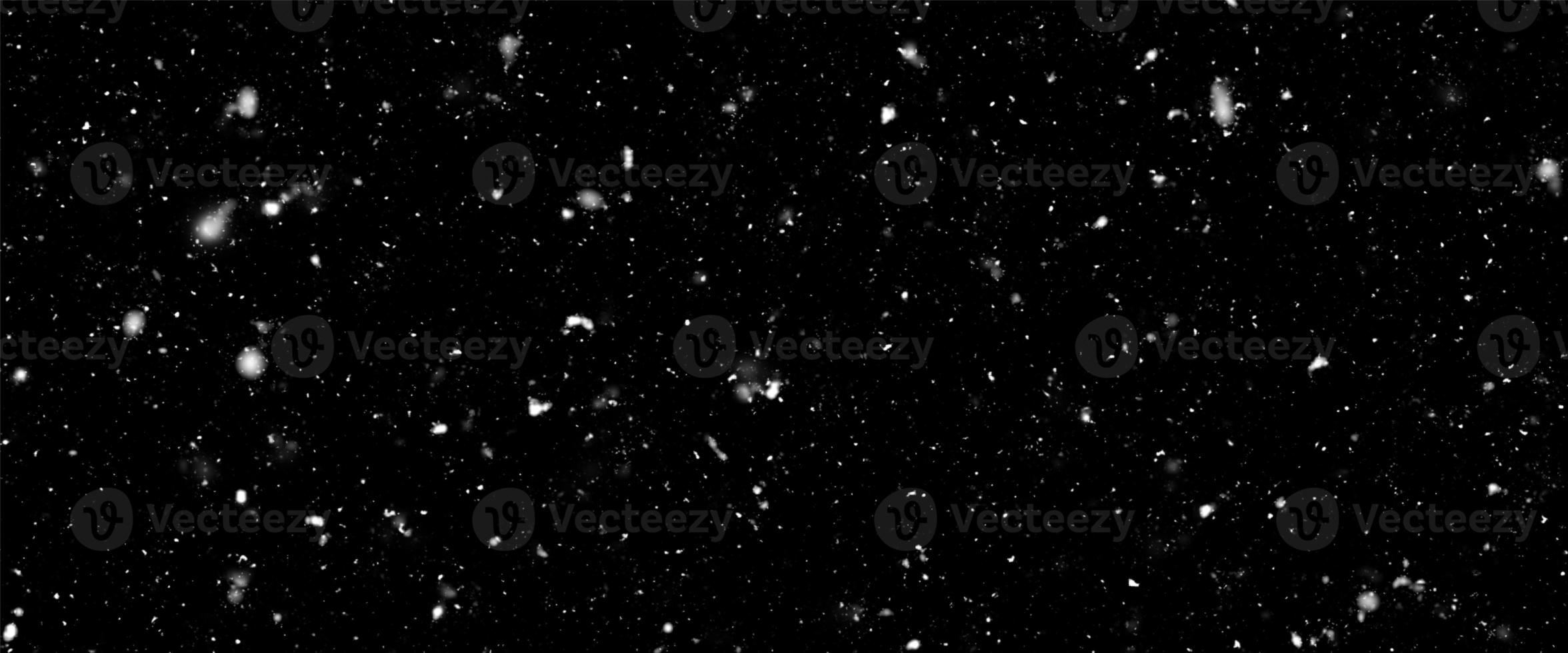 Falling snow flakes, Flying dust particles on a black background. Abstract winter background. Winter landscape with falling shining beautiful snow. photo