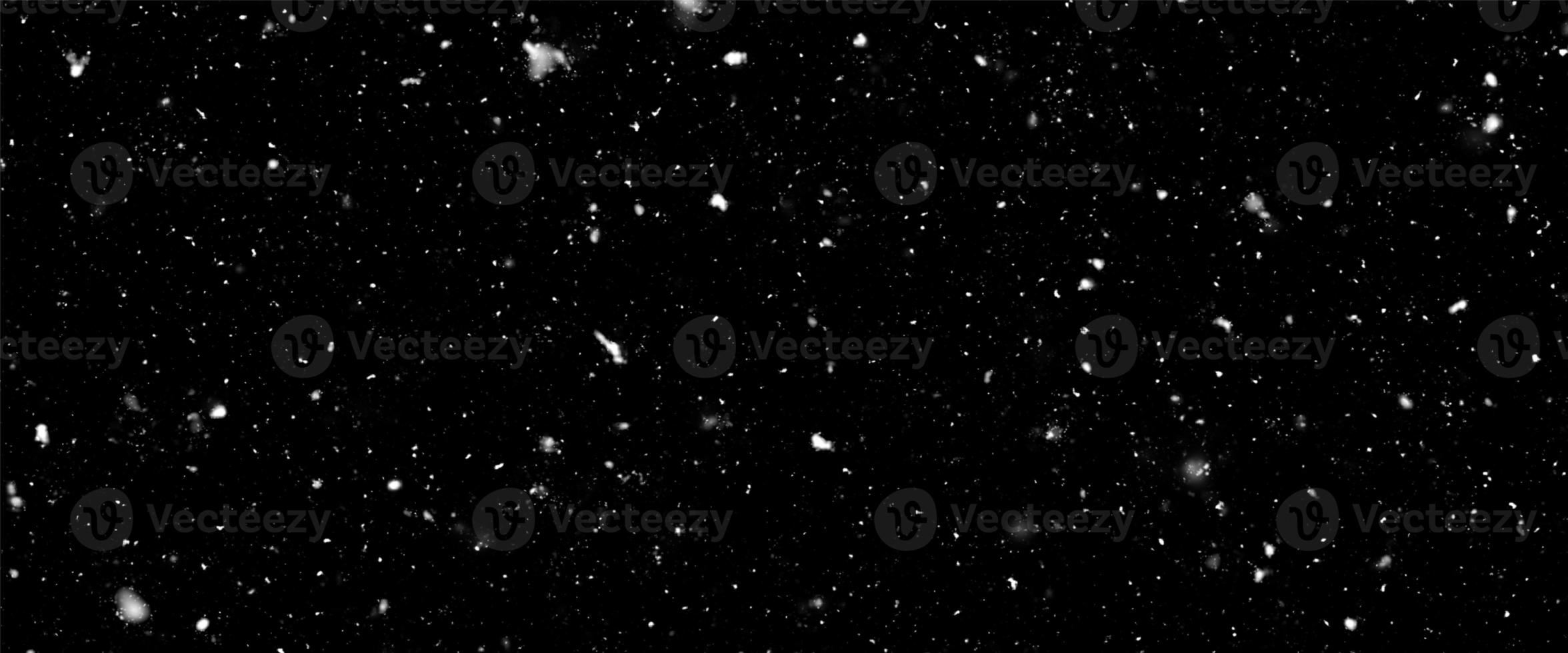 Falling snow flakes, Flying dust particles on a black background. Abstract winter background. Winter landscape with falling shining beautiful snow. photo