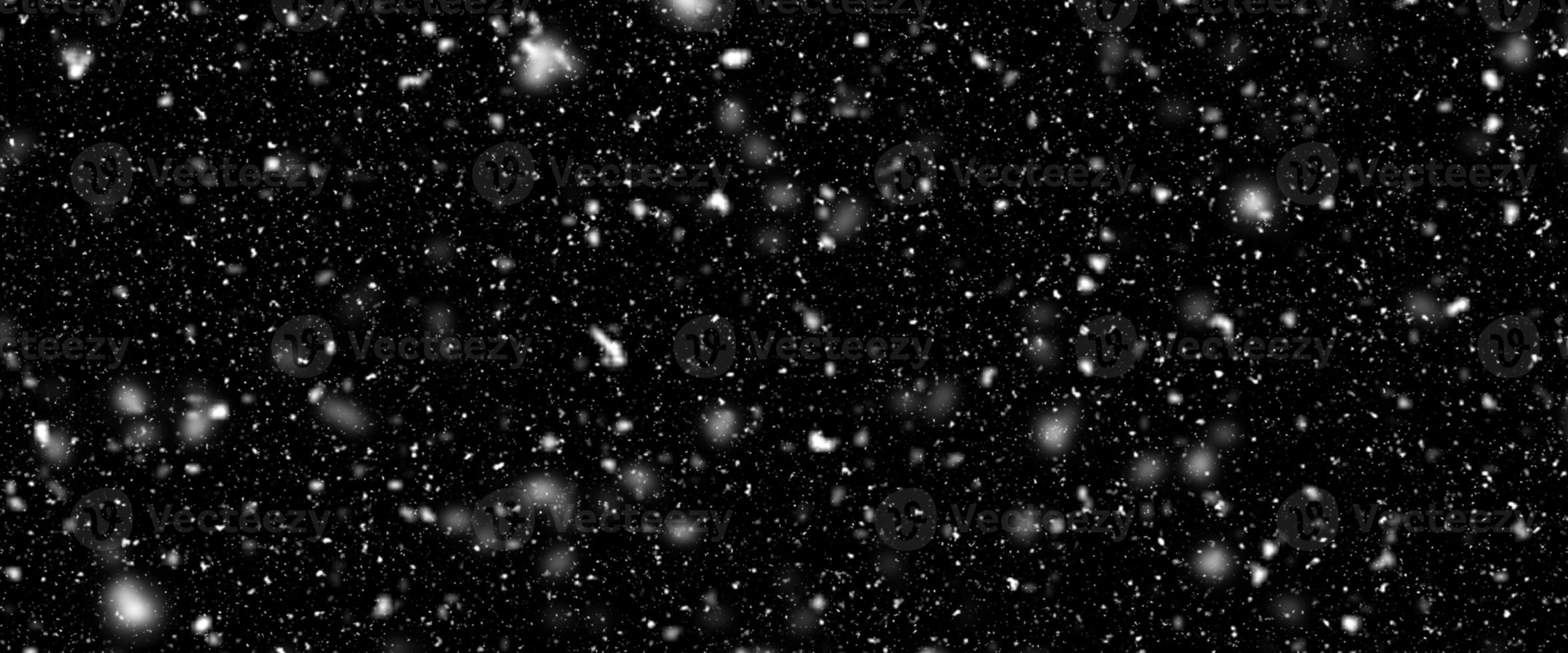 Snowfall bokeh on dark foundation. Numerous snowflakes in flying in the air. Winte night snowfall and snowstorm of snow at. Obscure bokeh light impact innovative foundation. photo