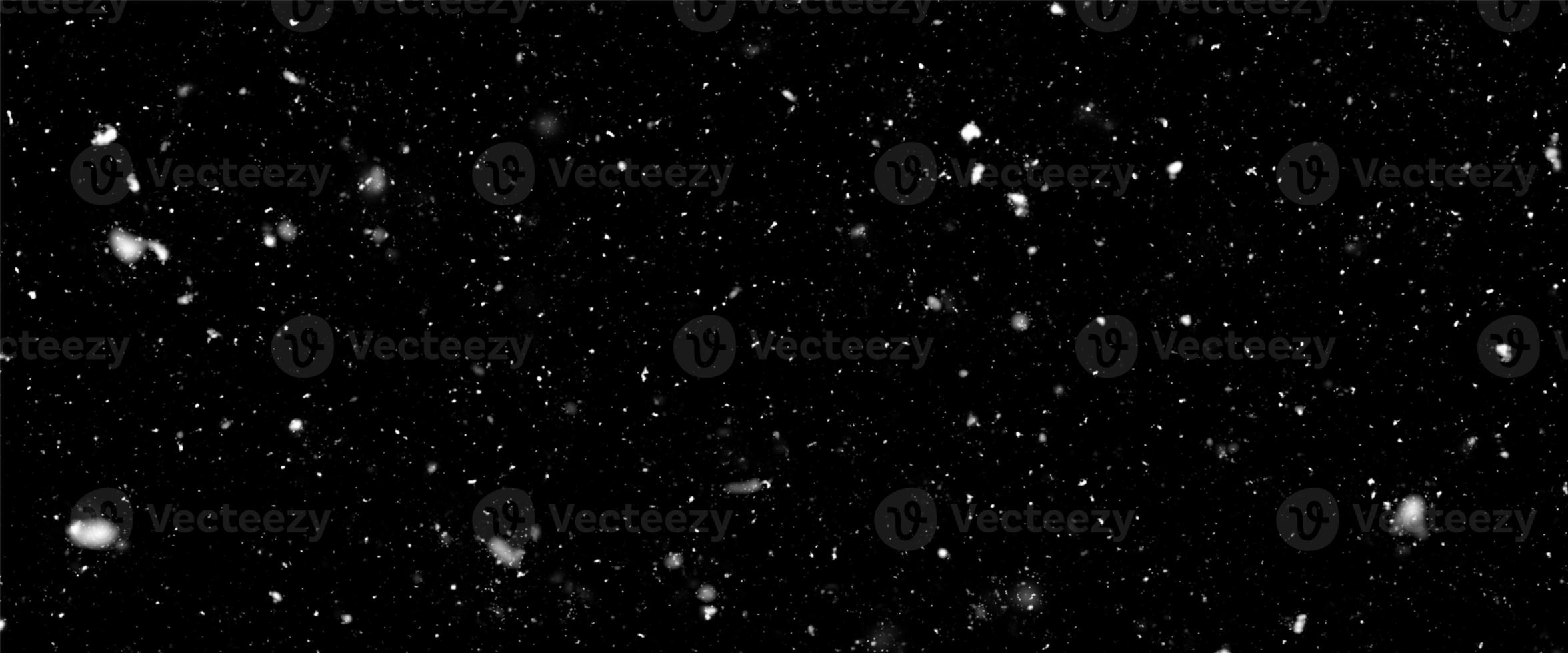 Snowfall bokeh on dark foundation. Numerous snowflakes in flying in the air. Winte night snowfall and snowstorm of snow at. Obscure bokeh light impact innovative foundation. photo