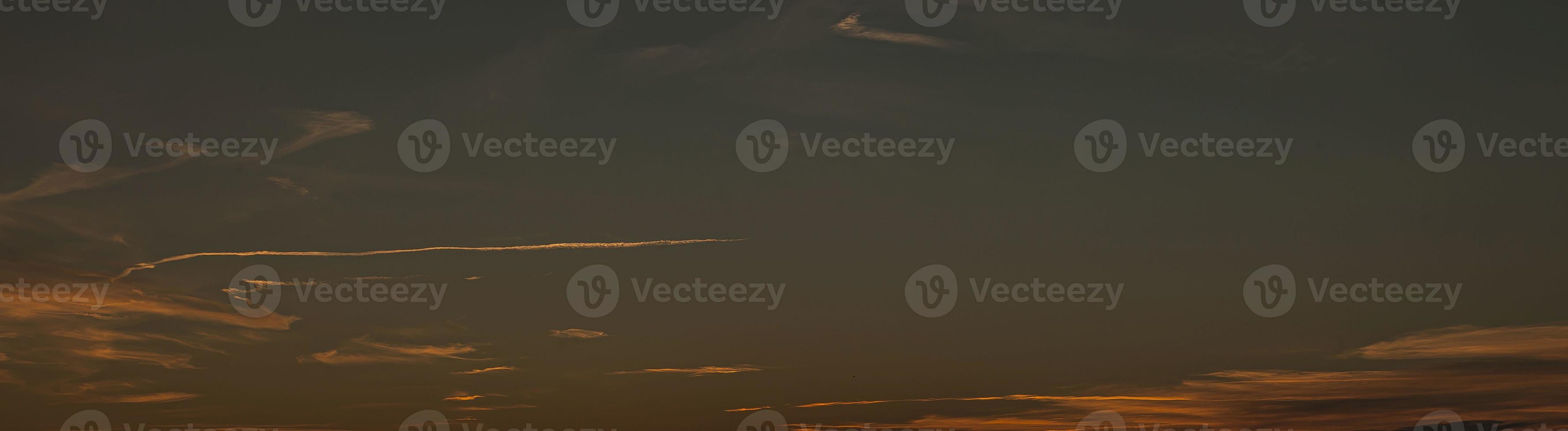 Dramatic colorful sky with afterglow and illuminated clouds photo