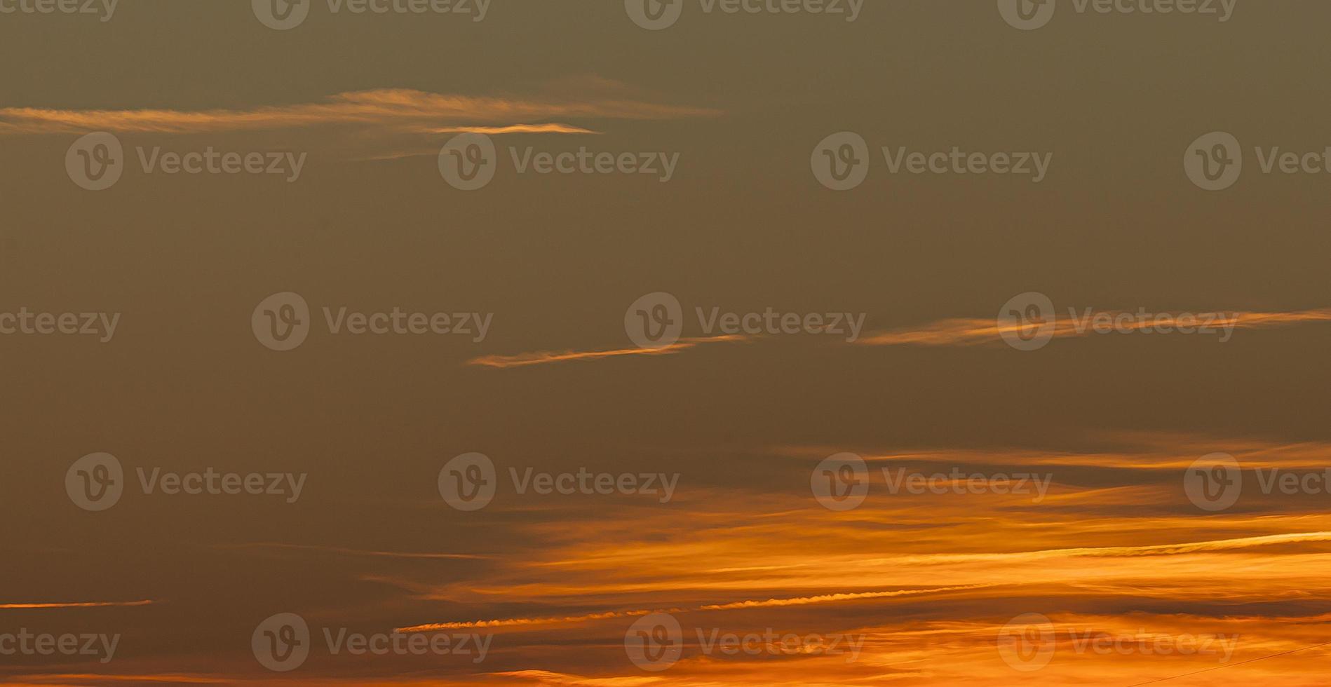 Dramatic colorful sky with afterglow and illuminated clouds photo