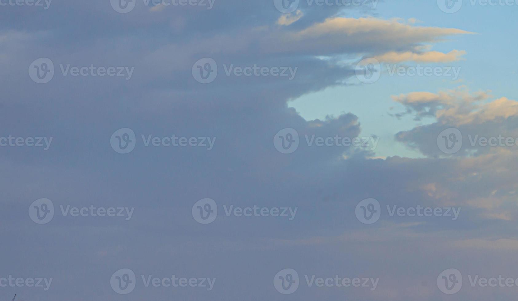 Image of a partly cloudy and partly clear sky during the day photo