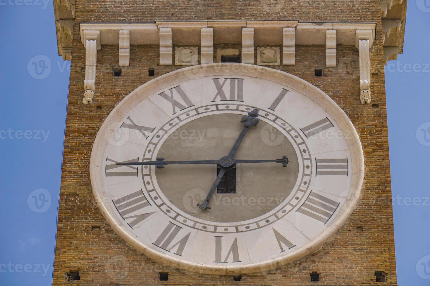 Clock at Torre dei Lamberti in Verona, Italy photo