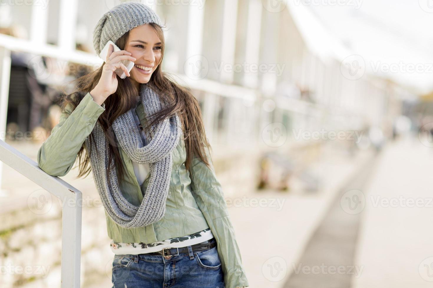 Young woman with mobile phone photo