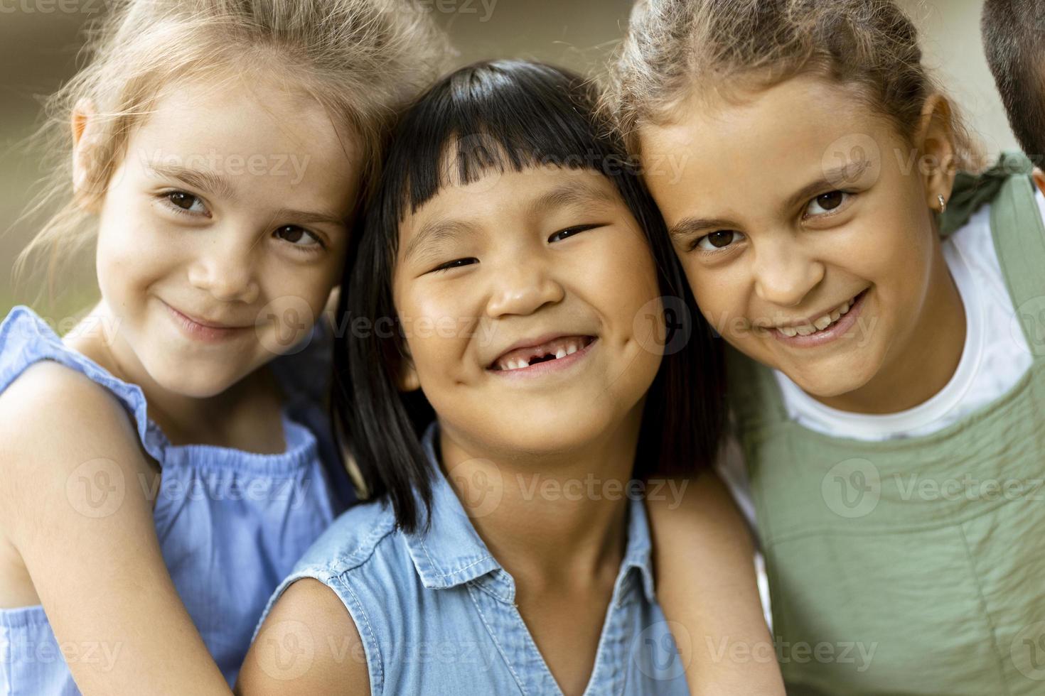 Group of asian and caucasian girls having fun in the park photo