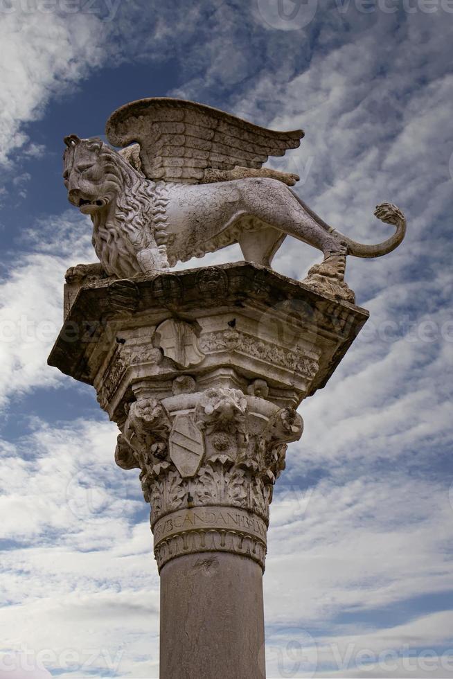 Column with the Venetian winged lion in Piazza dei signori in Vicenza, Italy photo