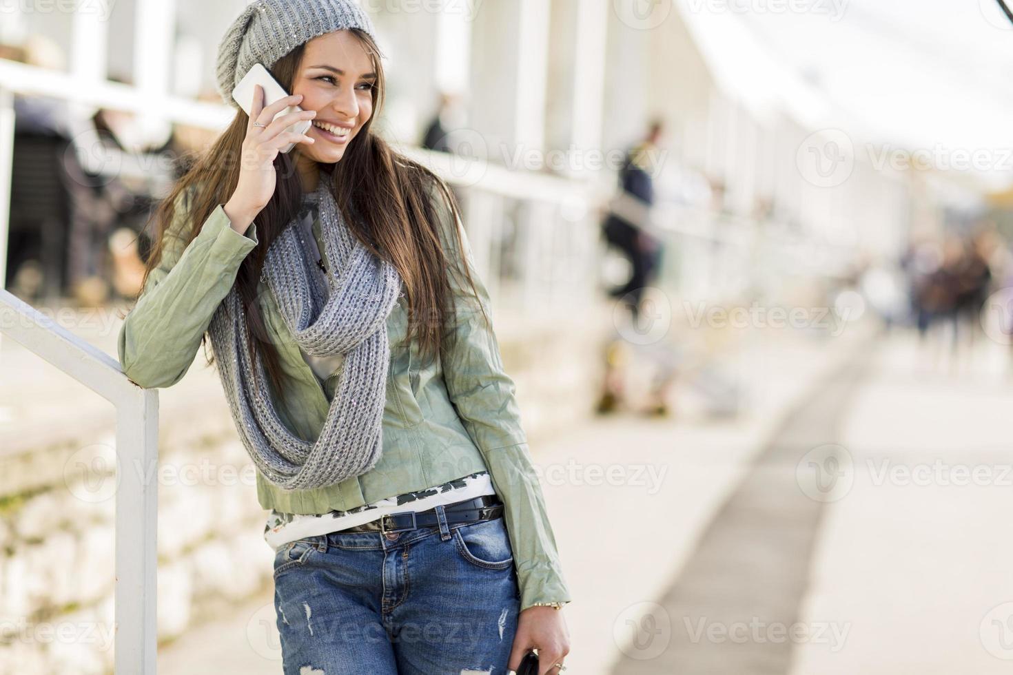 Young woman with mobile phone photo