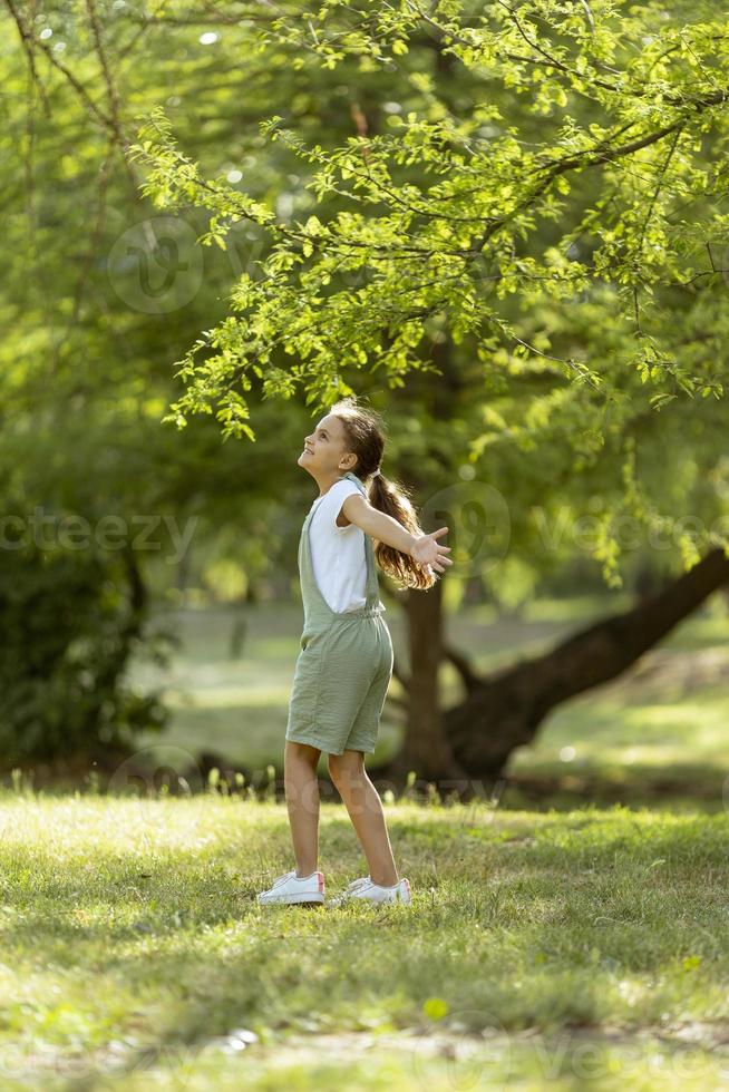 Little girl having fun in the park photo