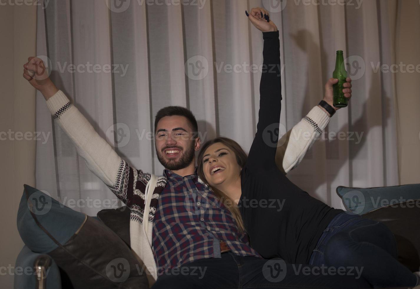 Young couple managing finances, reviewing their bank accounts using laptop computer. Woman and man doing paperwork together, paying taxes online on notebook pc photo