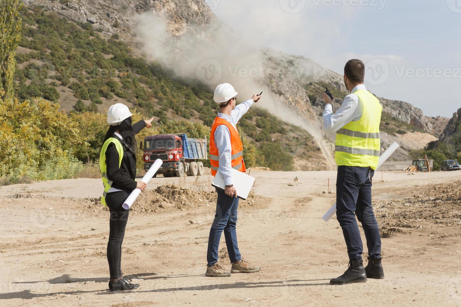 construction workers controlling explosion photo