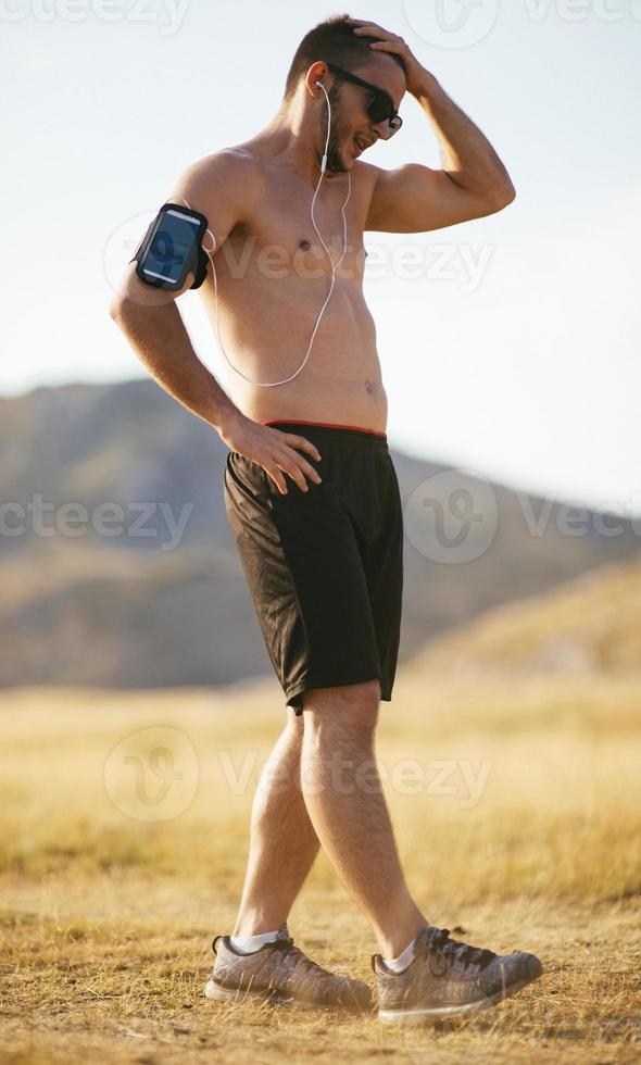 sunset and running young man photo