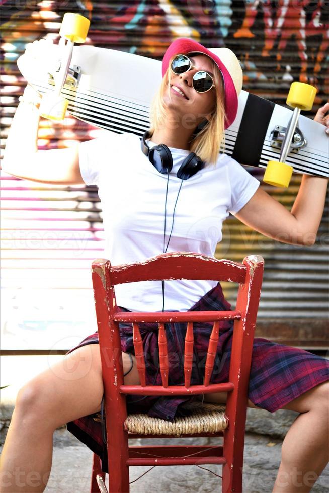 cool skateboard woman at a public graffiti park photo