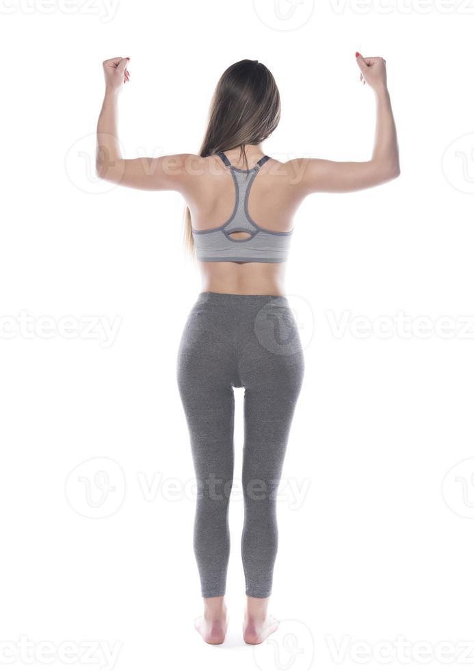 Female fitness or aerobic instructor with perfect body shape. isolated on white background photo