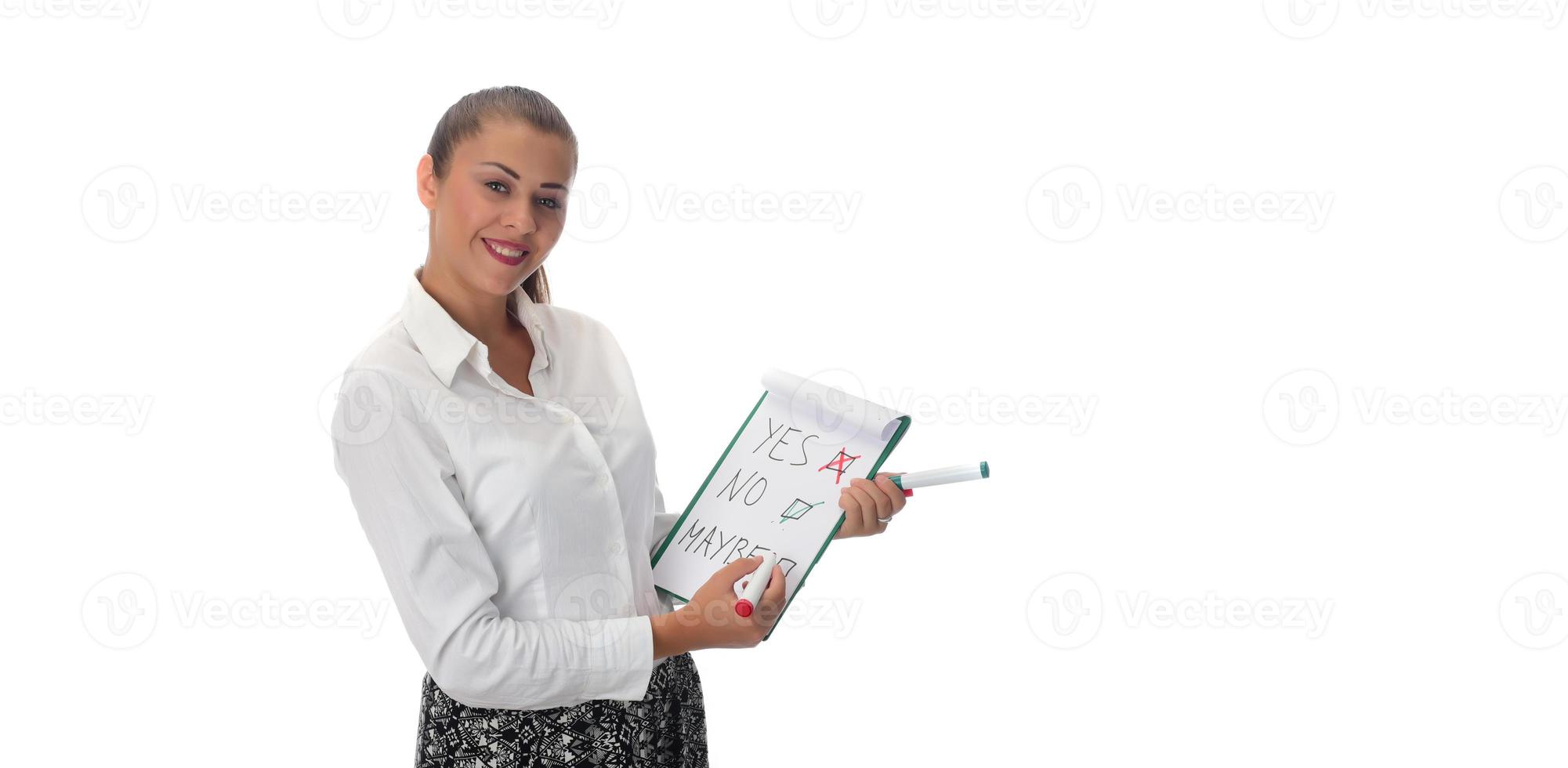 Happy young businesswoman doing business presentation at whiteboard, smiling, isolated on white background. photo