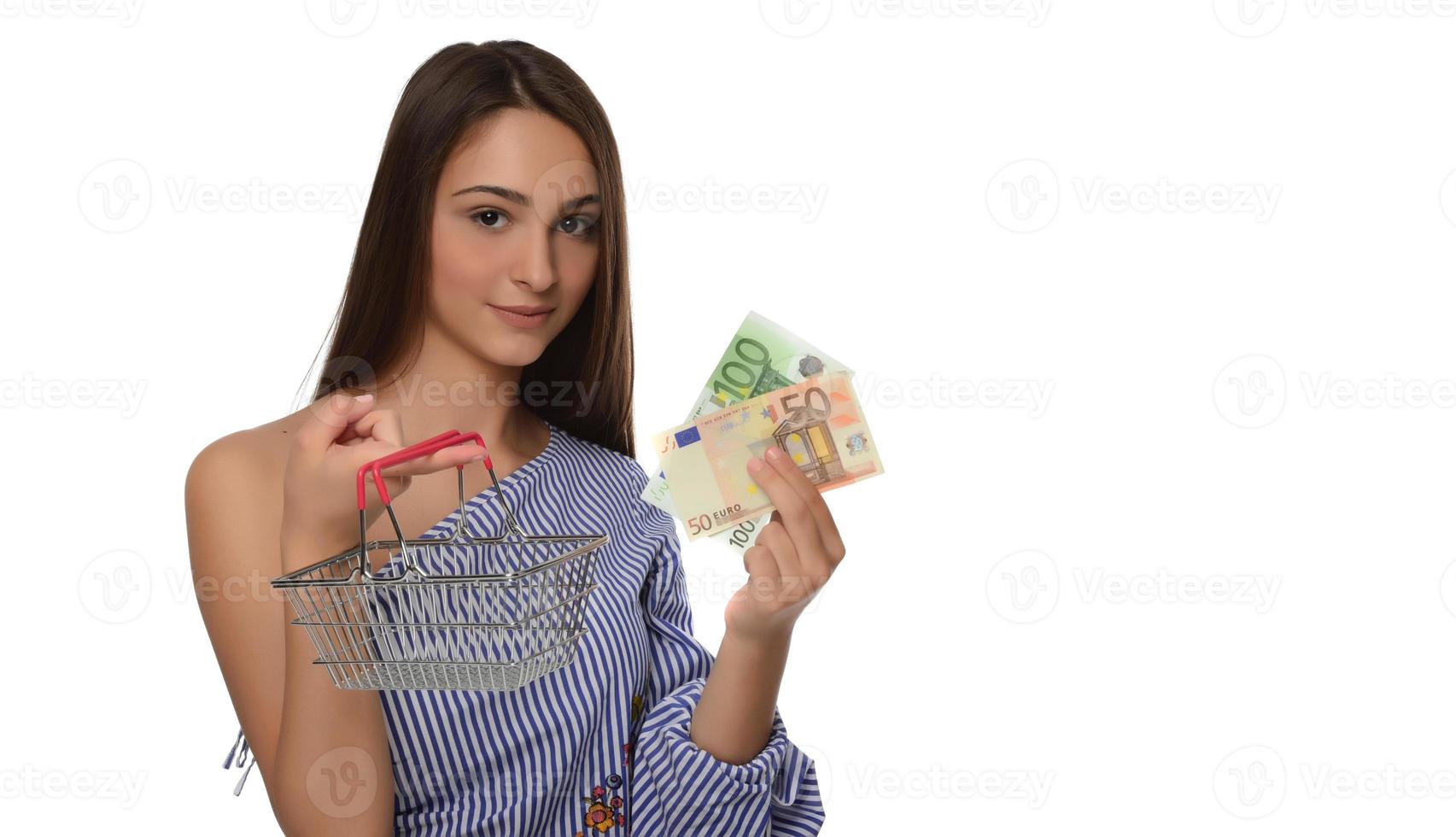 Young woman holding euro money isolated on white photo