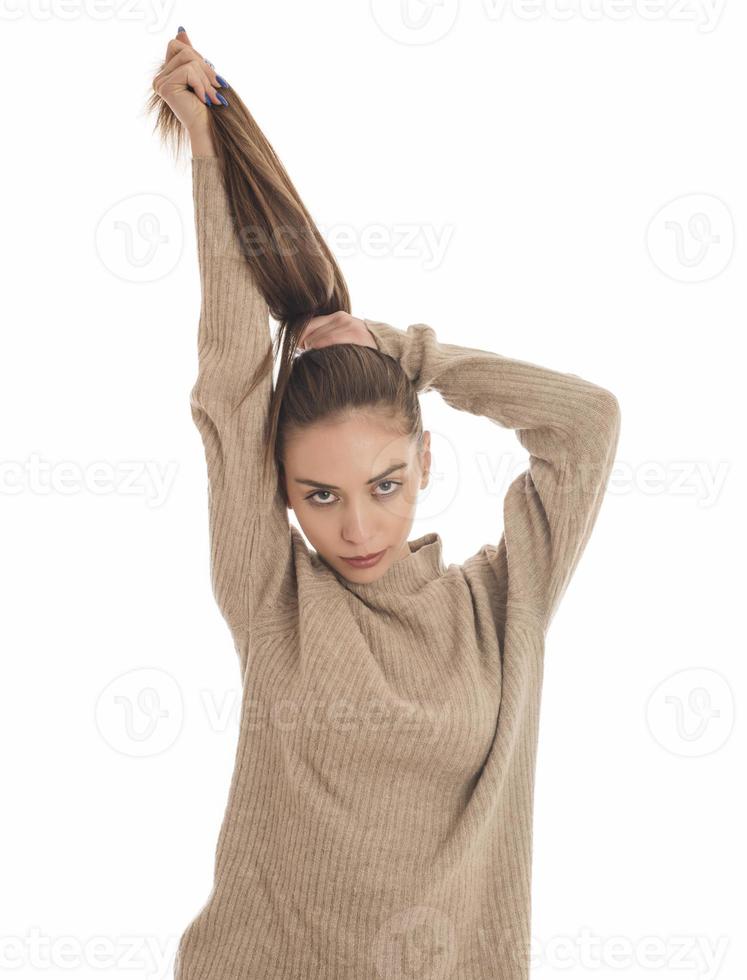 Portrait of a gorgeous young brunette woman with healthy hair. photo