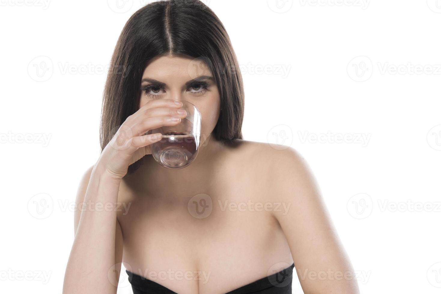 woman drinking water. isolated on white background photo