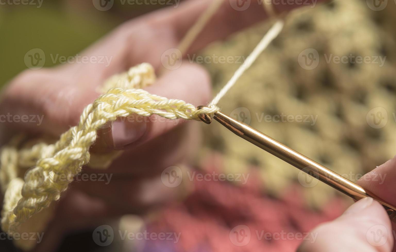 unrecognizable woman knitting photo