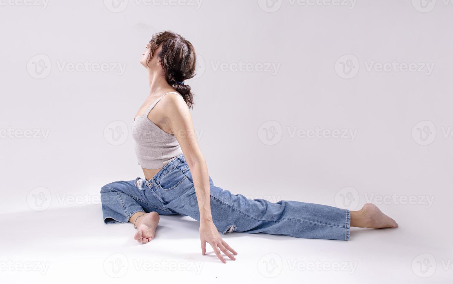 Young woman practising yoga photo