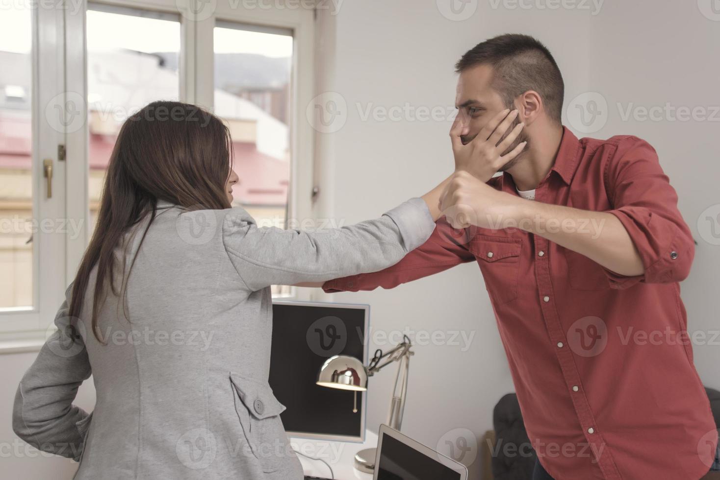 Emotional colleagues fighting in office. Workplace conflict photo