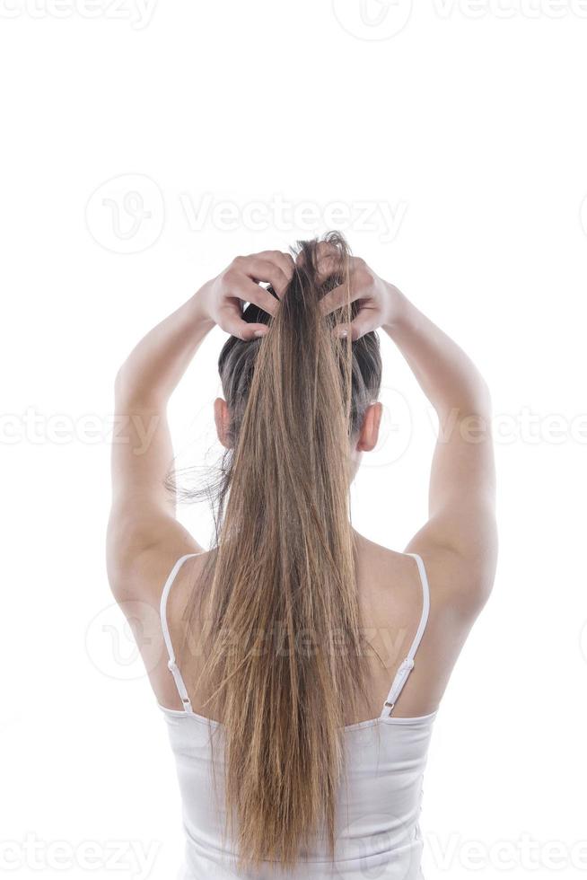 portrait of happy girl who holds her hair photo