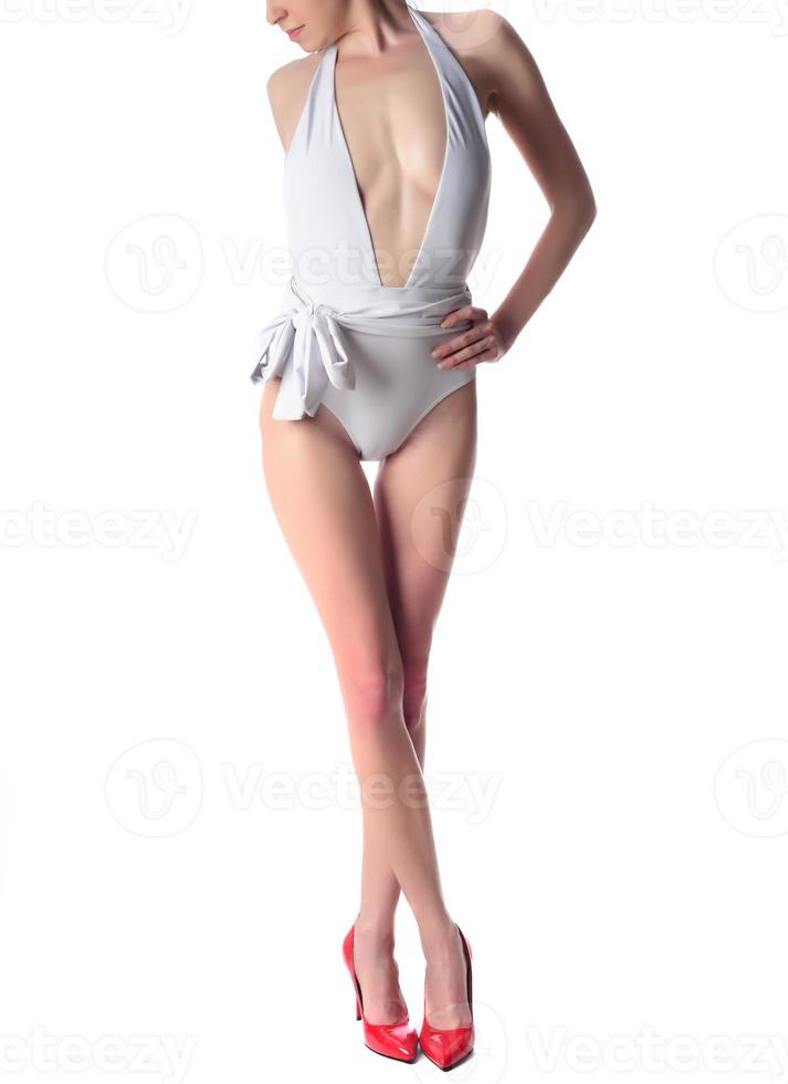 beautiful woman's legs in high hills, isolated on white background photo