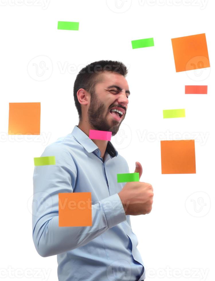 Portrait of a smiling businessman writing Business Plan on the screen photo