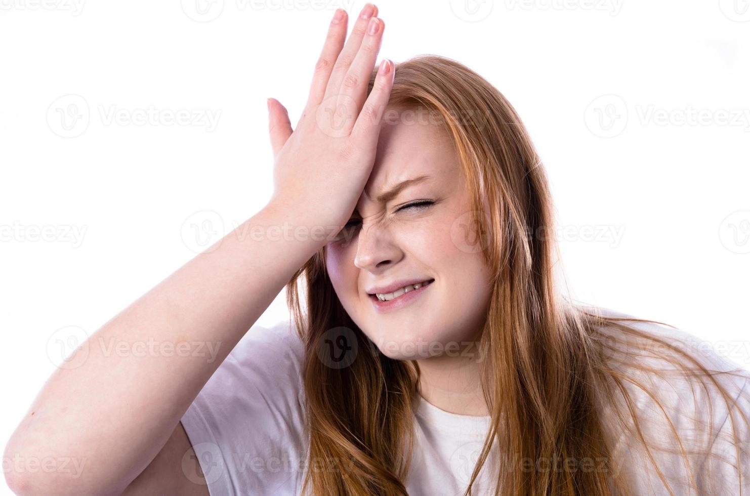 Portrait of beautiful young woman touching her temples feeling stress photo