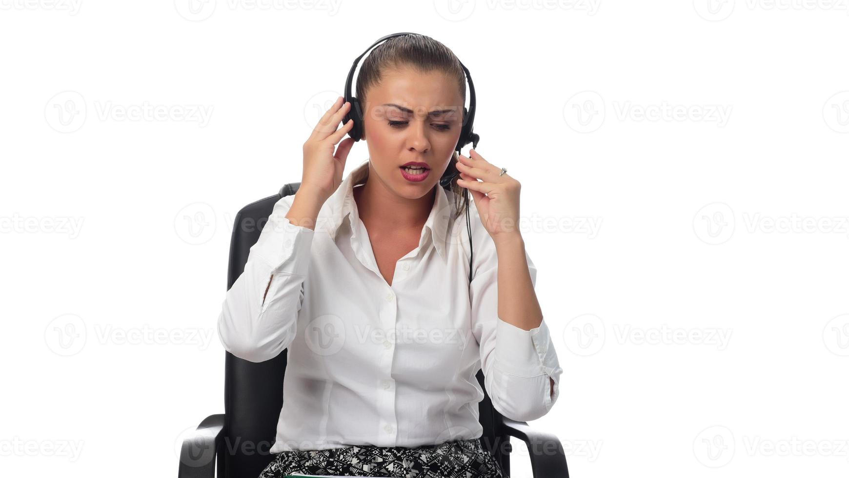 Personal assistant in the business. Hot helpline worker. Female Operator of call center with headset in white shirt photo