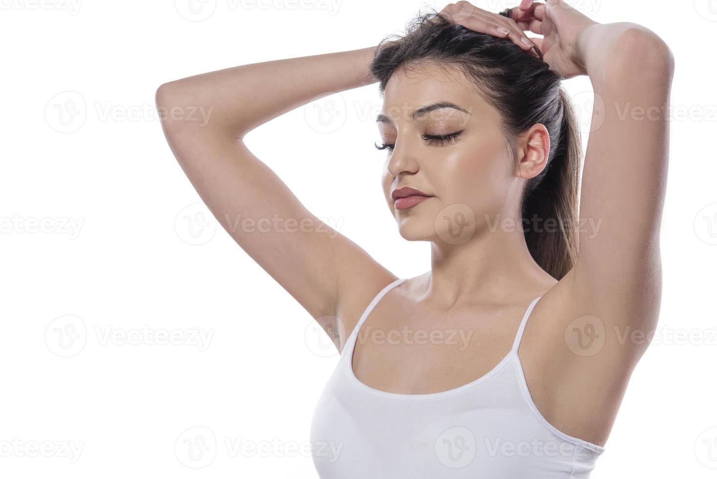 portrait of happy girl who holds her hair photo