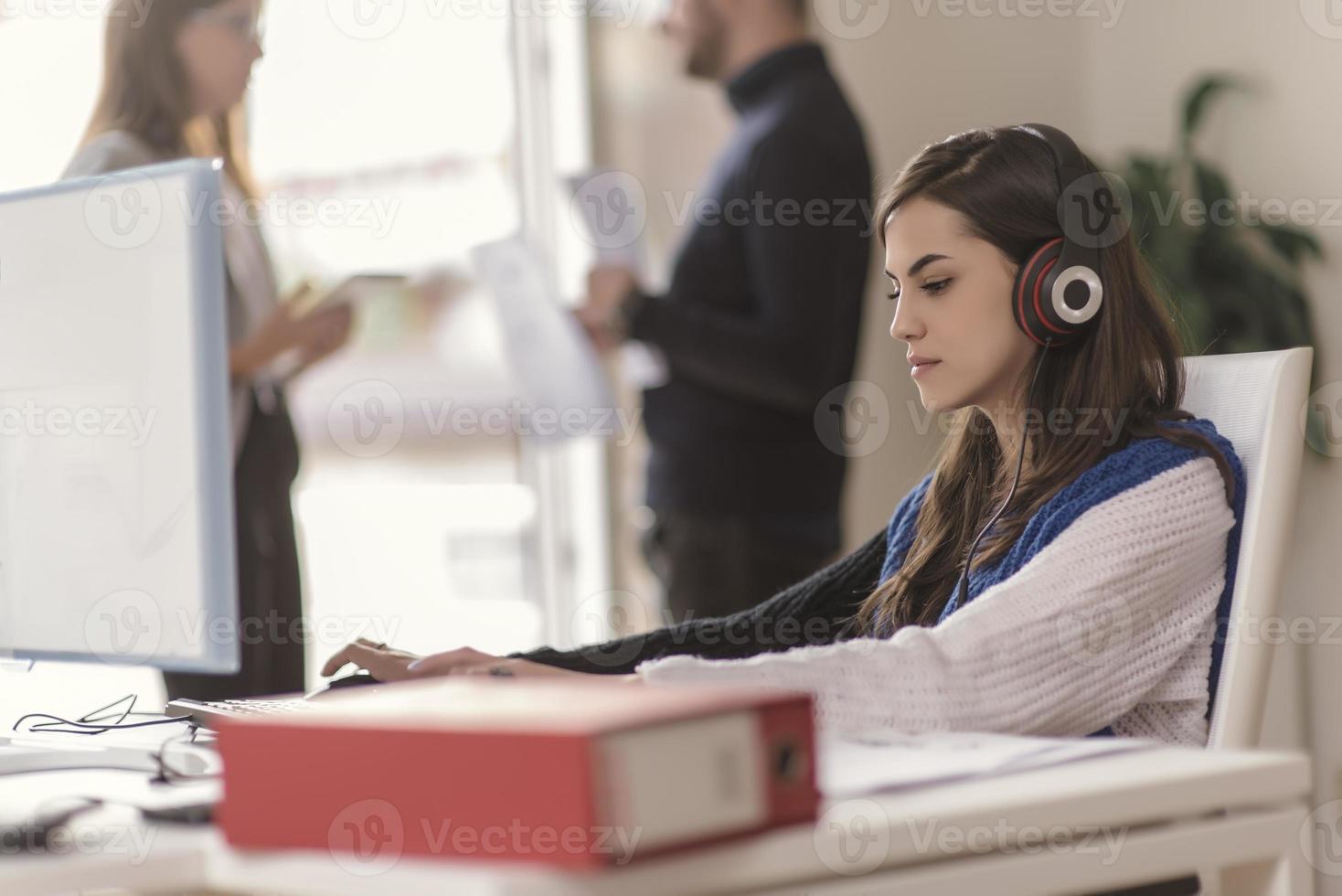 Two partnerships developing programming and coding technologies working on laptop and analyzing together. photo