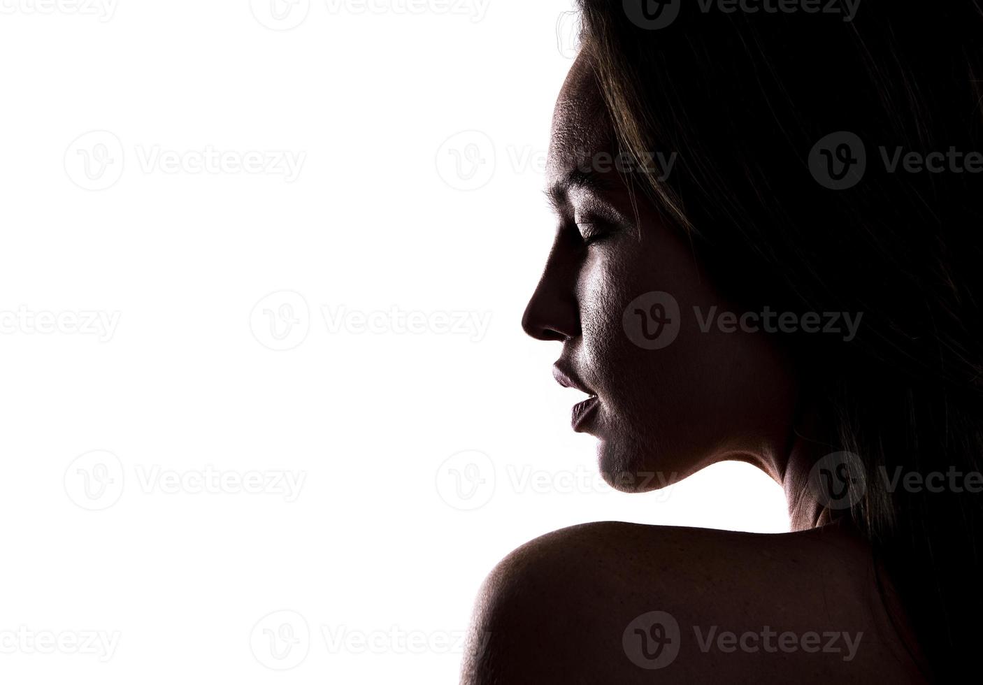 artistic view of depressed female model posing in studio photo