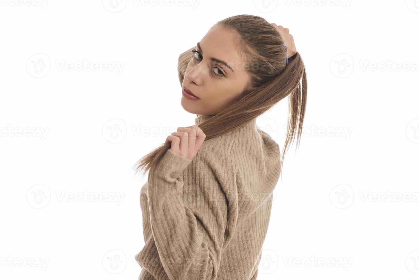 Portrait of a gorgeous young brunette woman with healthy hair. photo