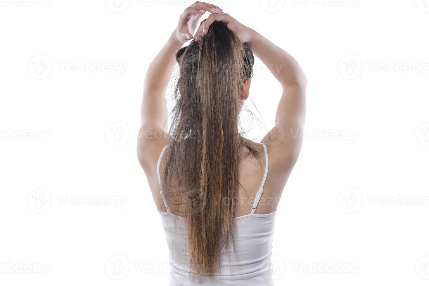 portrait of happy girl who holds her hair photo