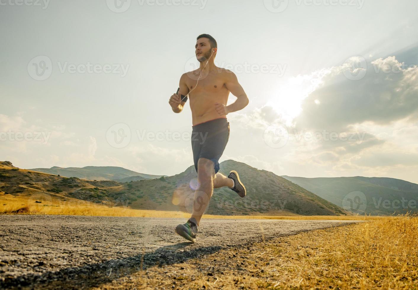 sunset and running young man photo