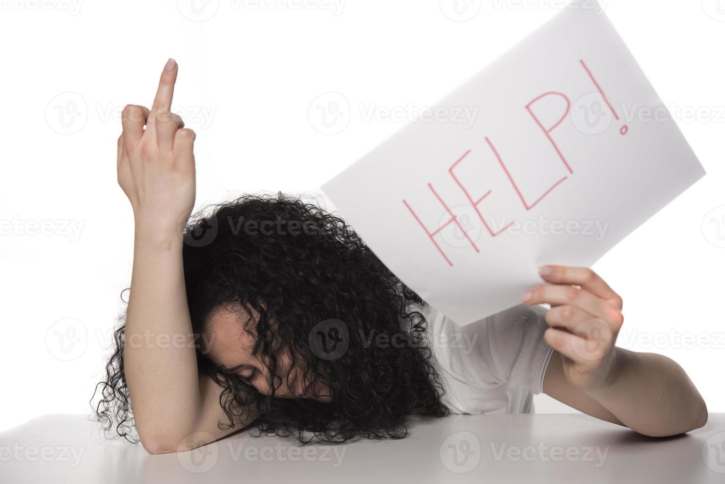 young attractive frustrated and tired businesswoman holding help sign message overworked at office computer, exhausted, sad under pressure and stress isolated on white photo