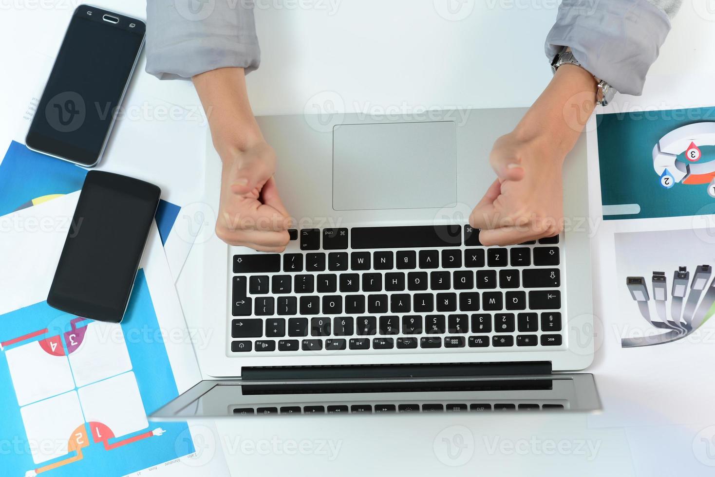 hands typing on the laptop on the business desk. business concept photo