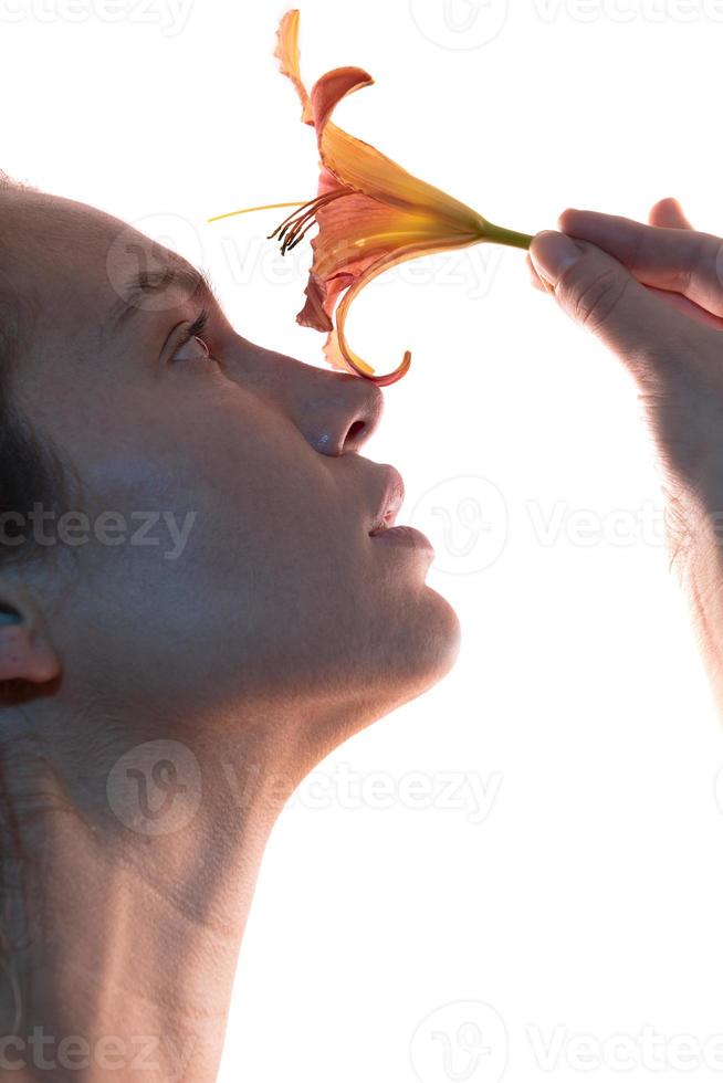 rtistic portrait of a female holding lily flower. Beauty concept.  isolated on white background photo