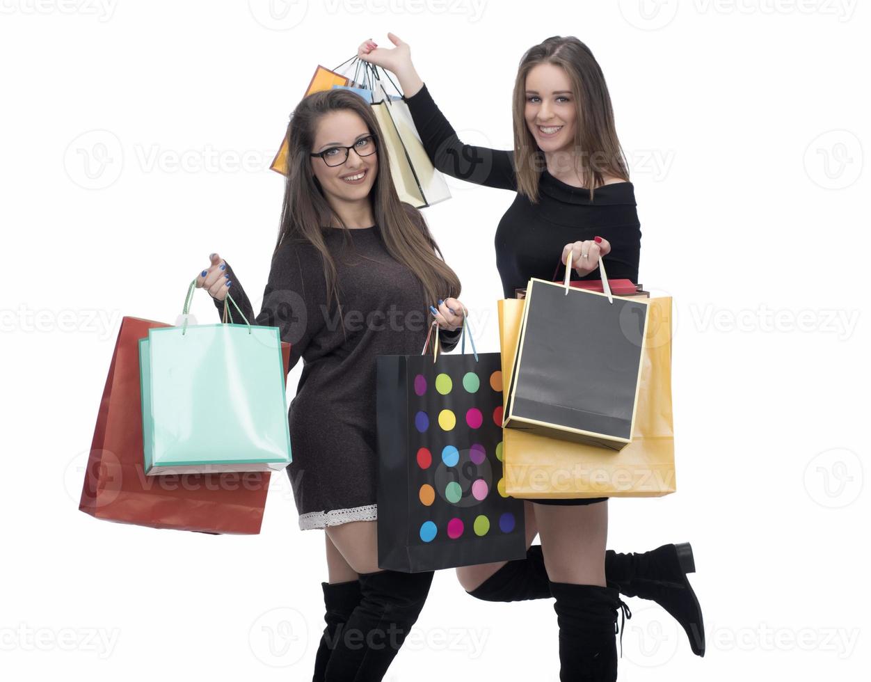 Happy friends with shopping bag on isolated studio background. photo