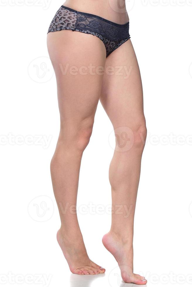 A picture of a sexy woman putting on panties over white background photo