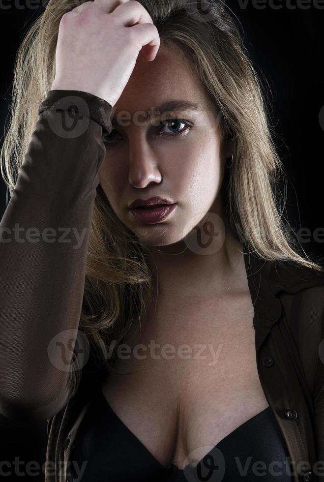 Fashionable woman with perfect smile and clean skin on black background photo