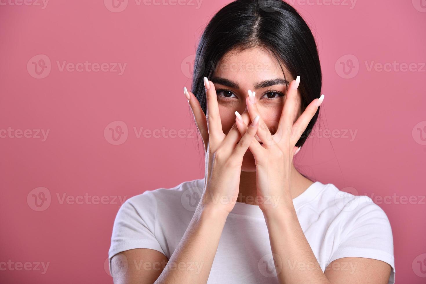 Photo of young asian girl amazed shocked afraid scared hands cover face eye look