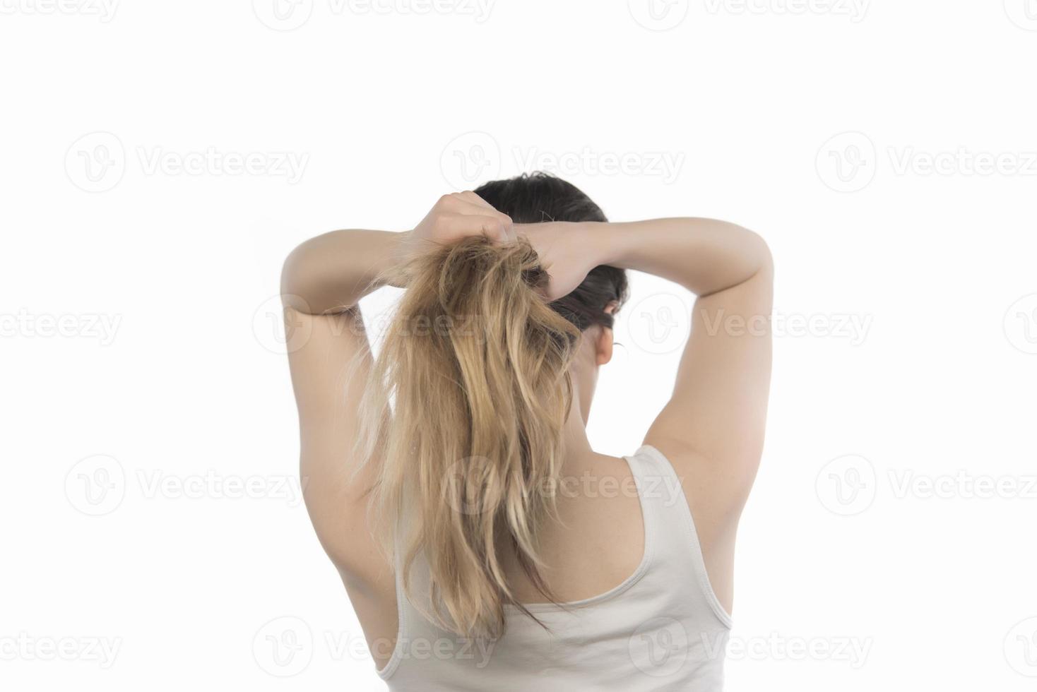 woman arranging her hair photo