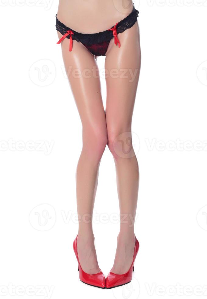 beautiful woman's legs in high hills, isolated on white background photo