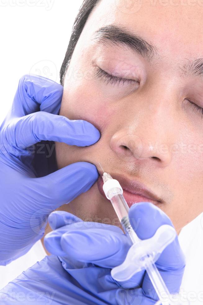 Man Having Botox Treatment At Beauty Clinic photo