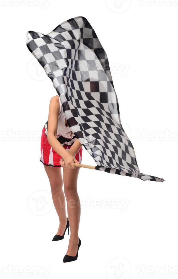 beautiful model holding finish flag isolated on white background. motorsport finish flag in hands female model. photo